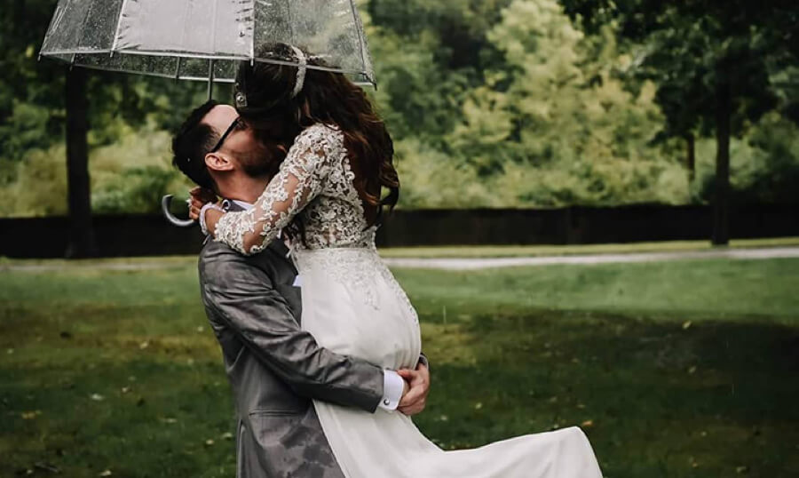 Bride and groom on a rainy day