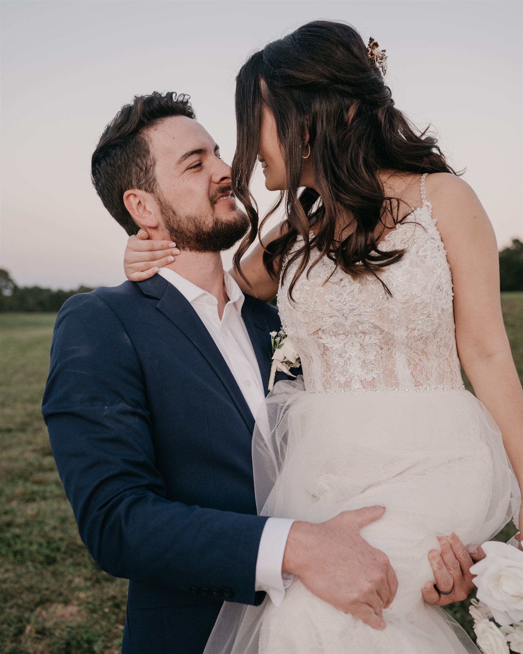 Groom holding bride at their wedding venue in South Carolina