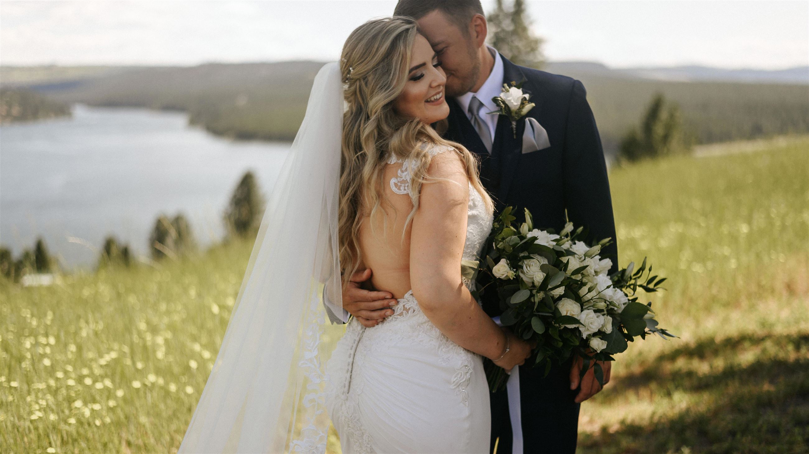 Bride and groom holding each other on their wedding day
