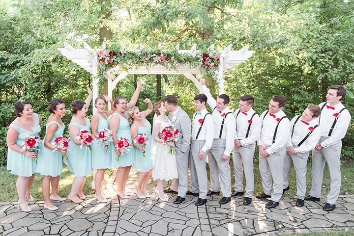 wedding party standing in front of the altar