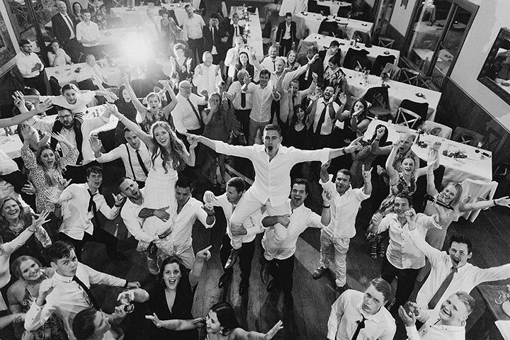 bride and groom celebrating with guests at reception