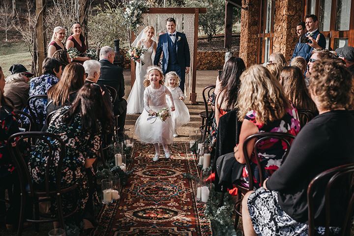 flower girls coming down the aisle before bride