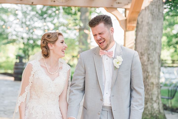 bride and groom laughing together